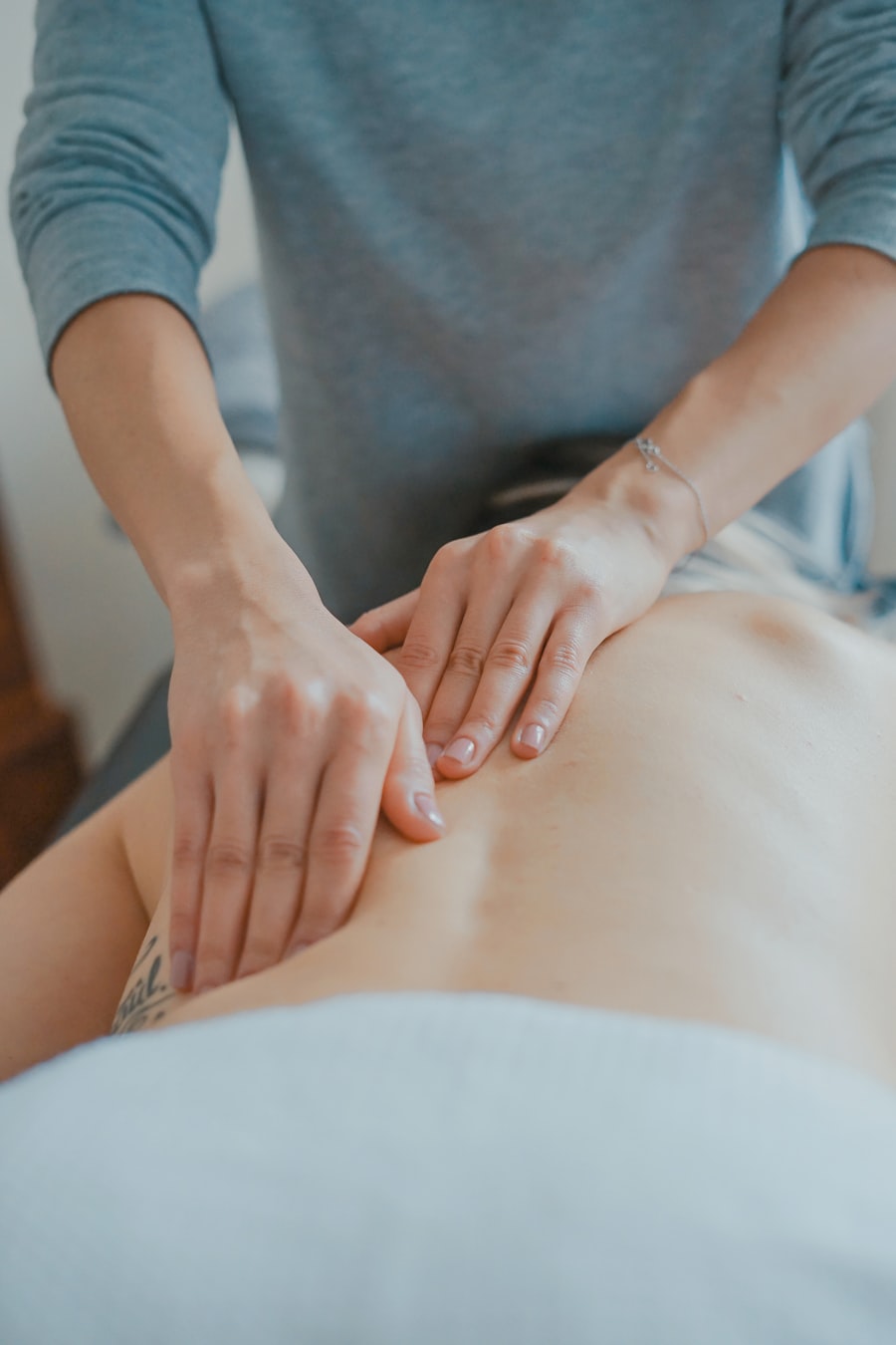Therapist's hands performing a relaxing back massage